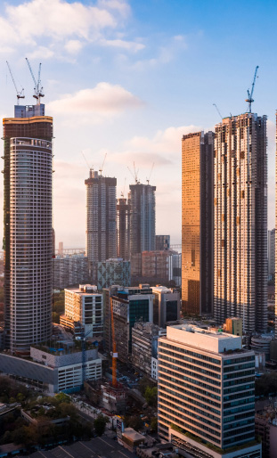 A modern city skyline at sunset, representing corporate car rental services in Islamabad from Micro Car Rental.