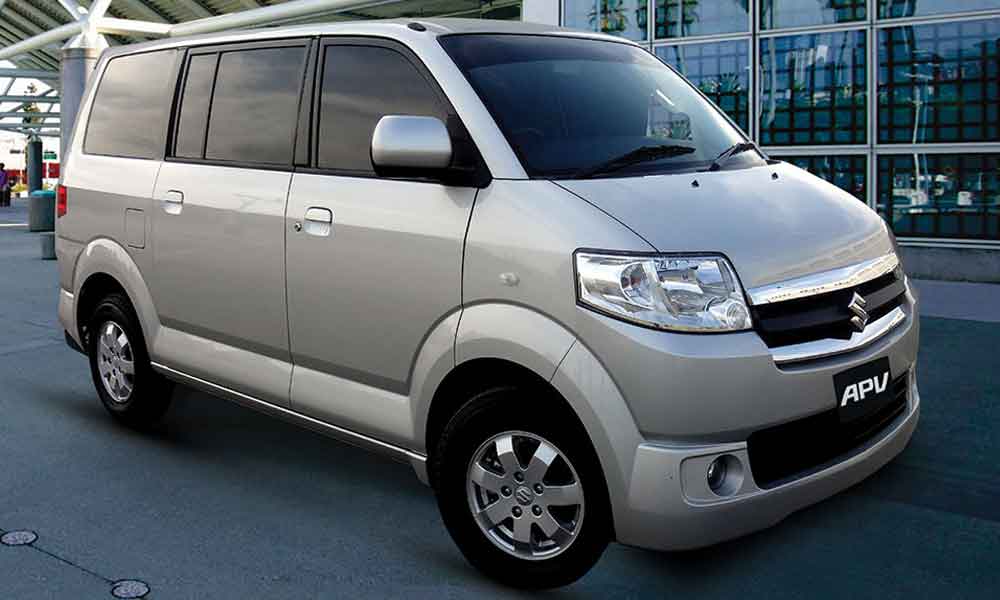 Customized silver Toyota Hiace high-roof commuter van, perfect for comfortable large group and long-distance travel. Available for hire from Micro Car Rental in Islamabad.