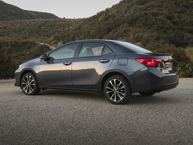 Image of a clean gray Toyota Corolla for rent in Multan from Micro Car Rental.